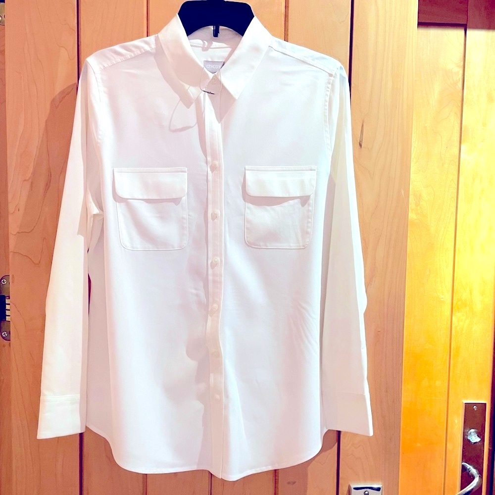 Chico’s New. Cream color, long-sleeve camp shirt.  Looks like silk.  Washable.